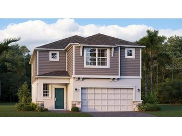 Charming two-story home with gray siding, a two-car garage, a teal front door, and lush surrounding landscaping at 5103 Bridgehaven Rd, Davenport, FL 33837