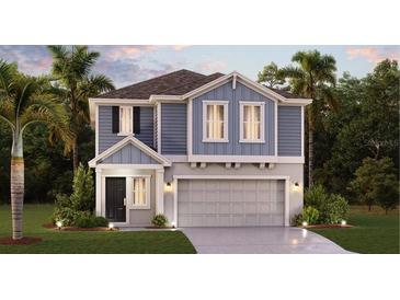 Charming two-story home with a well-manicured lawn, two-car garage, and inviting entryway at 5625 Gingham Dr, Kissimmee, FL 34758