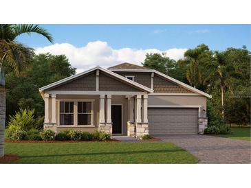 Charming single-Gathering home features stone accents, two-car garage, inviting front porch, and well-maintained landscaping at 4117 Jespersen St, Apopka, FL 32712
