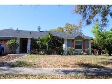 Charming single-story home with well-maintained landscaping and a welcoming entrance at 1000 Andrea Ridge Ct, Kissimmee, FL 34747