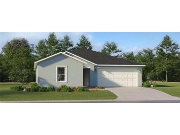 Charming one-story home featuring a well-maintained lawn and two-car garage at 1178 Hour Glass Rd, Lakeland, FL 33801