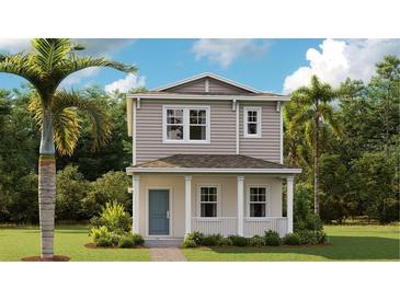 Charming two-story home with a welcoming front porch and meticulously manicured lawn at 750 Honeyrock St, Debary, FL 32713