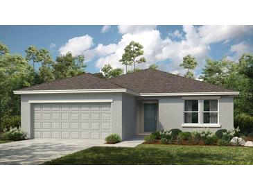 Charming one-story home with a two-car garage and manicured landscaping at 140 Jones Fish Camp Rd, Edgewater, FL 32141