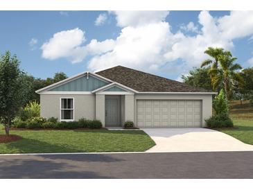 Charming single-story home featuring a two-car garage and lush green lawn at 1538 Sage Ave, Haines City, FL 33844