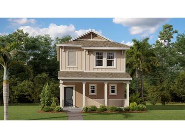 Charming two-story home showcasing a welcoming front porch and a well-manicured lawn with lush trees at 815 Middleton St, Debary, FL 32713