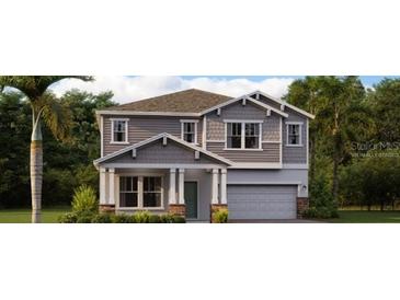 Two-story home showcases a front yard with a mix of green bushes and well-maintained landscaping at 3235 Armstrong Ave, Clermont, FL 34714