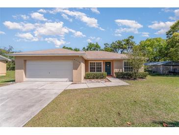 Charming single-story home featuring a well-maintained lawn and attached two-car garage at 4530 Old Road 37, Lakeland, FL 33813