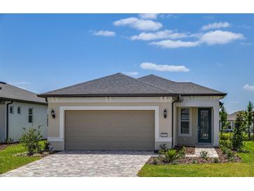 Charming single-story home with a two-car garage and well-manicured landscaping at 5831 Sw 87Th Ave, Ocala, FL 34481