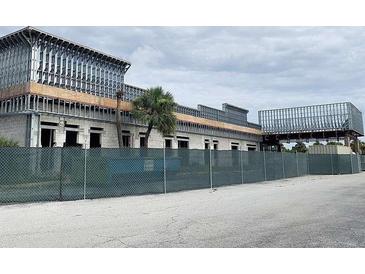 Commercial building under construction with steel framework and concrete block walls at 7900 S Orange Blossom Trl # 1099, Orlando, FL 32809