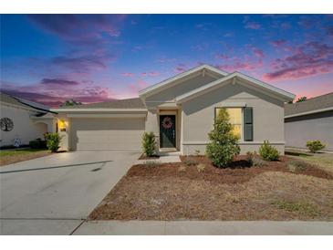 Charming single-story home with a well-maintained lawn and a welcoming front entrance, creating a cozy curb appeal at 272 Pershing St, Bartow, FL 33830