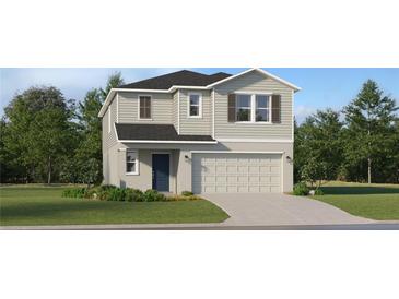 Charming two-story home with a two-car garage, manicured lawn, and traditional architectural details at 971 Hour Glass Rd, Lakeland, FL 33801