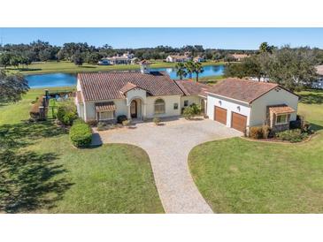 Stunning single-story home with tile roof, circular driveway and attached garage at 12329 Sw 140Th Loop, Dunnellon, FL 34432