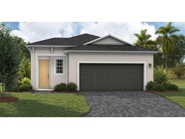 Charming single-story home featuring a two-car garage and a well-maintained front yard with lush landscaping at 6229 Sw 96Th Pl, Ocala, FL 34476
