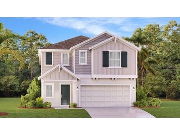 Charming two-story home with a clean design, well-manicured lawn, and beautiful trees at 5636 Gingham Dr, Kissimmee, FL 34758