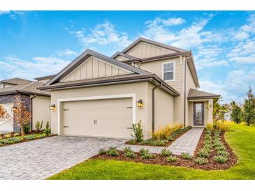 Beautiful two-story home with a two car garage, tidy landscaping, and neutral color palette at 7740 Somersworth Dr, Kissimmee, FL 34747