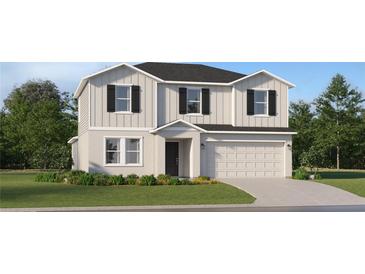 Charming two-story home with a two-car garage, neutral siding, black shutters, and a well-manicured lawn at 4742 Bold Peacock Bnd, Bartow, FL 33830