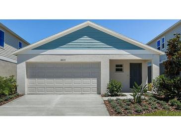 Charming single-story home featuring a two-car garage and a welcoming entryway at 1772 Frogmore Ave, Haines City, FL 33844