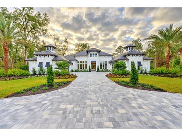 Stunning new construction with gorgeous driveway and beautifully landscaped front yard at 1829 Adrian Creek Blvd, Port Orange, FL 32128