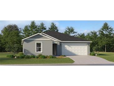 Charming single-story home with a well-manicured lawn and an attached two-car garage at 2192 Albatross Nest Dr, Bartow, FL 33830