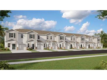Row of townhouses with neutral colors, garages, and well-maintained landscaping on a sunny day at 3090 Chantilly Dr, Davenport, FL 33837