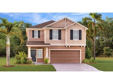 Charming two-story home with landscaped front yard, garage, and inviting entrance in a desirable neighborhood at 5686 Portico Pl, Kissimmee, FL 34758