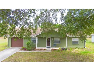 Charming single-story home with a well-manicured front yard and a welcoming entrance at 14791 Sw 29Th Avenue Rd, Ocala, FL 34473
