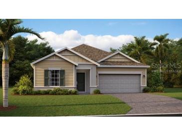 Charming one-story home with a two-car garage, well manicured lawn, and tropical landscaping at 4662 Coral Harbour Rd, Kissimmee, FL 34758