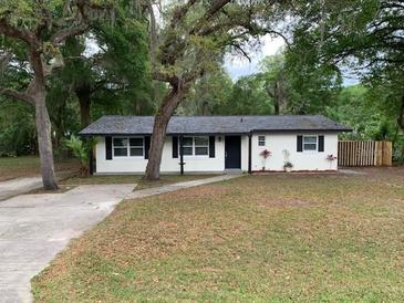 Charming home with a well-maintained front yard and mature trees offers great curb appeal at 3601 Ne 24Th Ct, Ocala, FL 34479