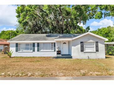 Charming one-story home featuring a neutral exterior, well-maintained lawn and traditional architectural details at 1480 E Davidson St, Bartow, FL 33830
