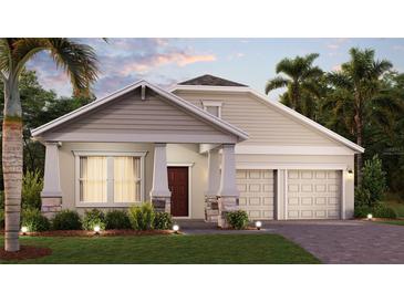 Beautiful exterior elevation features a two car garage, stone accents, and a well-manicured lawn with trees at 1863 Clear Sky Dr, Kissimmee, FL 34744