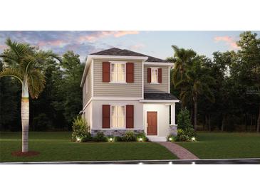 Charming two-story home with stone accents, neat lawn, and attractive landscaping at 1880 Bright Sky Dr, Kissimmee, FL 34744