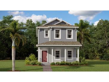 Charming two-story home featuring a cozy front porch and well-maintained landscaping at 785 Middleton St, Debary, FL 32713