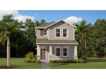 Charming two-story home with neutral colors, landscaped yard, and classic architectural details at 797 Middleton St, Debary, FL 32713