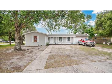 Charming single-story home with a well-maintained front yard and a cozy porch at 995 Merrimac St, Deltona, FL 32725