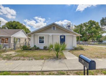 Charming single-story home with a well-manicured lawn, sidewalk, and a mailbox in a sunny neighborhood at 701 N Vermont Ave, Lakeland, FL 33801