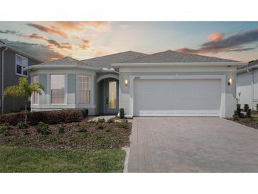 Charming single-story home with a well-manicured front yard and inviting curb appeal at 2797 Top Hill Ct, Minneola, FL 34715