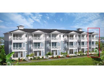 Beautiful exterior elevation showing multiple units with blue accents, white trim, and manicured landscaping at 23 Marden Dr # 51, Ormond Beach, FL 32176