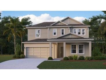 Charming two-story home featuring a symmetrical facade, neutral color palette, and attached two-car garage at 3288 Armstrong Ave, Clermont, FL 34714