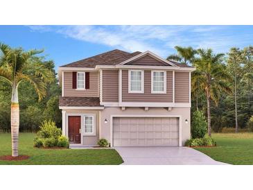 Charming two-story home featuring manicured landscaping and a convenient two-car garage, offering curb appeal and practicality at 5615 Vinyasa Rd, Clermont, FL 34714
