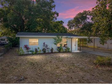 Charming single-story home with well-maintained landscaping and a covered entry during a beautiful dusk at 1205 Crestwood Dr, Winter Haven, FL 33881