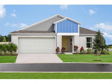 Charming single-Gathering home with a well-manicured lawn and a two-car garage on a sunny day at 1054 Foreshore Ln, Haines City, FL 33844