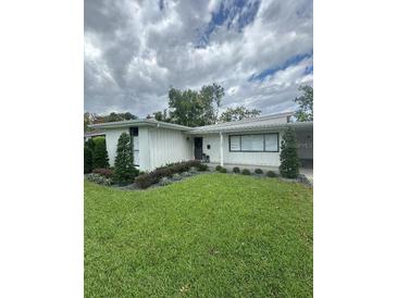 Charming single-story home featuring a well-manicured lawn and freshly painted exterior at 1105 Chichester St, Orlando, FL 32803