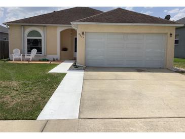 Charming single-Gathering home with a well-maintained lawn and two-car garage at 2057 Swift Rd, Oviedo, FL 32766