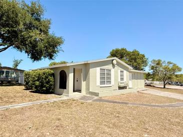 Charming single-story home featuring a well-maintained lawn and mature trees at 2201 Flamingo Ave, Deltona, FL 32738