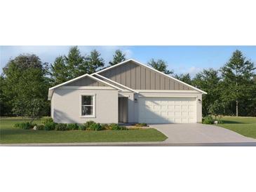 Charming single-story home with a two-car garage and well-manicured lawn in a quiet neighborhood at 1169 Hour Glass Rd, Lakeland, FL 33801