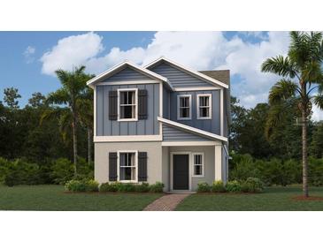 Charming two-story home with blue siding, gray accents, and a welcoming front entrance at 2879 Transformation Way, Clermont, FL 34714