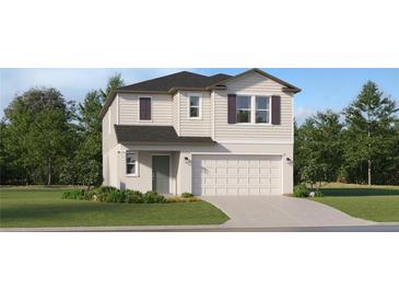 Charming two-story home with a well-manicured lawn, attached garage, and appealing neutral-colored exterior at 7558 Headwaters Ct, Groveland, FL 34736