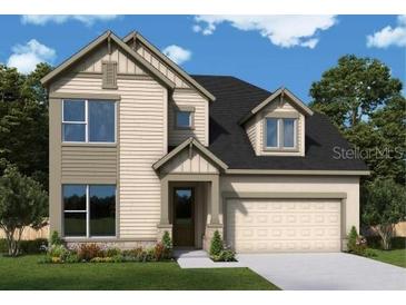 New two-story home featuring a two-car garage and craftsman-style details at 16954 Cedar Valley Cir, Clermont, FL 34711