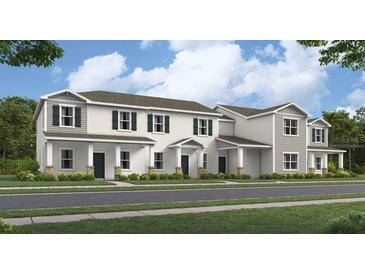 Charming townhomes with neutral exteriors and lush landscaping at 2301 White Buffalo St, Apopka, FL 32703