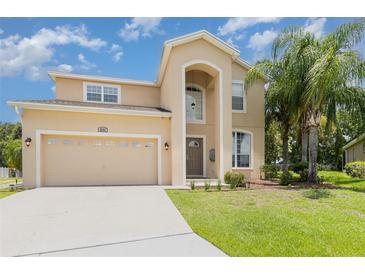 Charming two-story home with well-maintained lawn and two car garage at 2721 Stonewood Dr, Lakeland, FL 33810